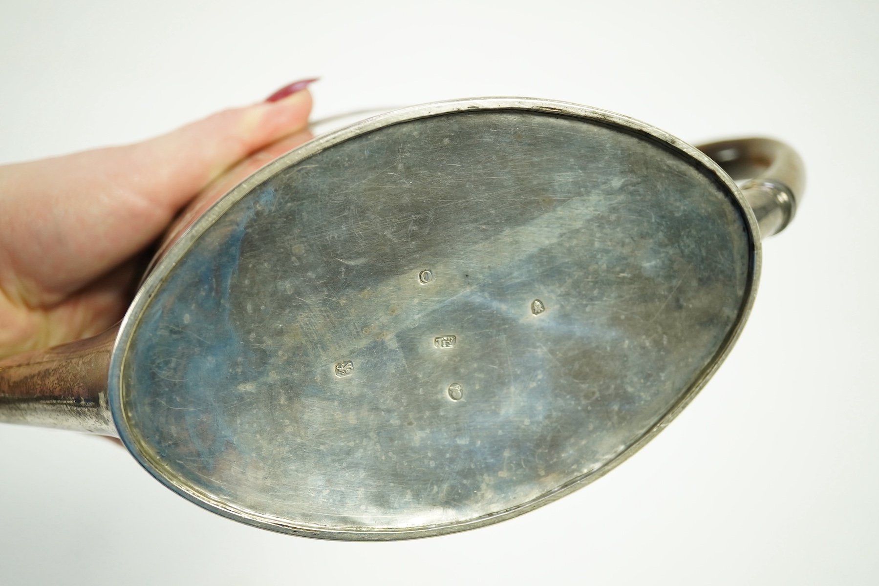 A George III silver oval teapot, overstruck maker's mark, T?